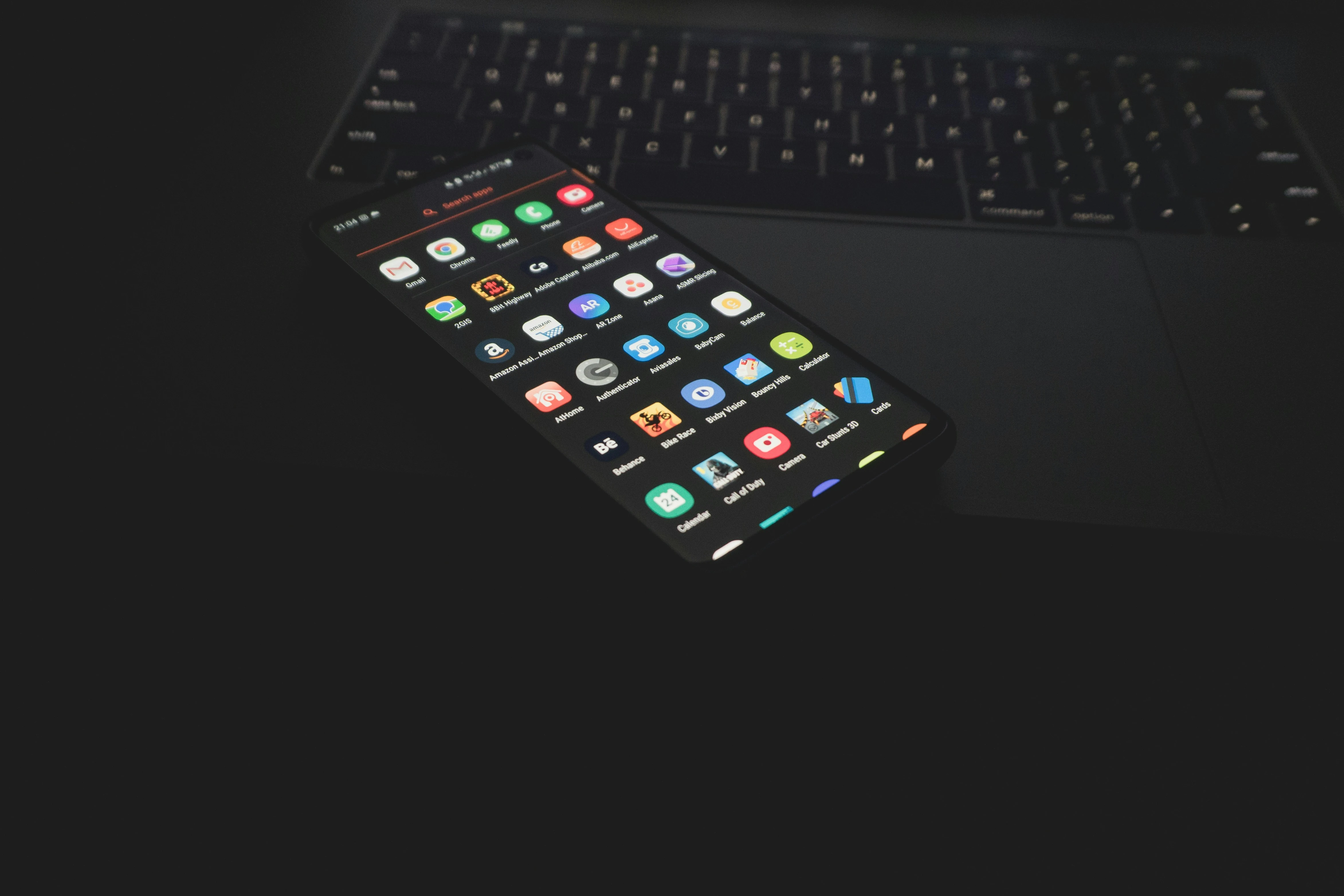 Laptop and smartphone workspace for custom app planning